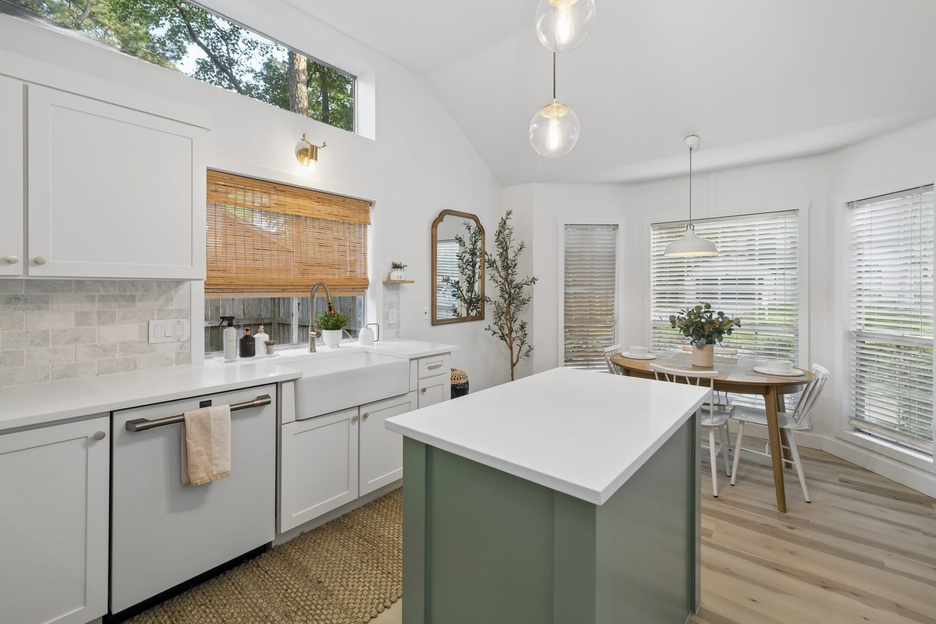 Modern gourmet kitchen with marble island and barstool dining