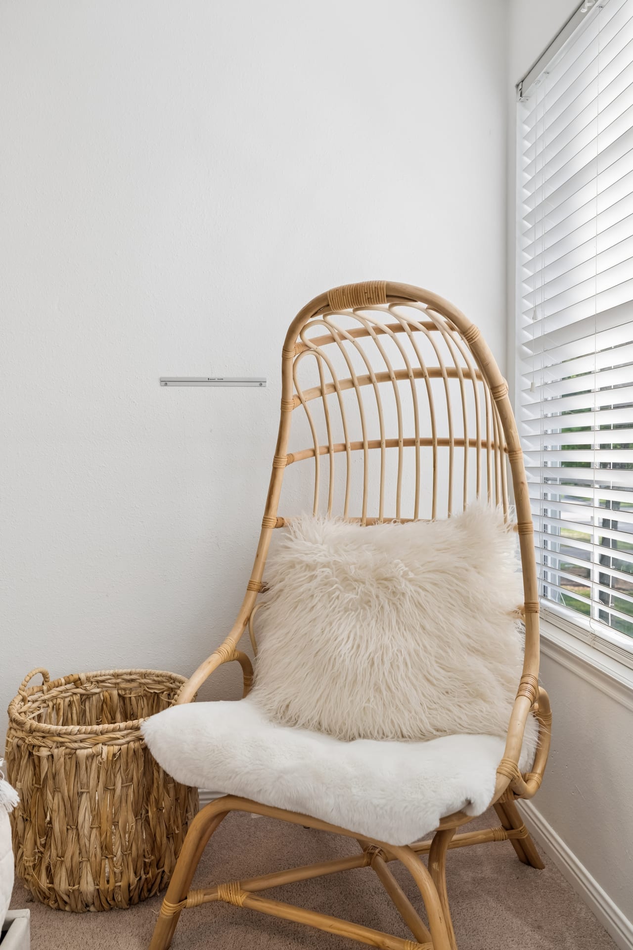 Shoppable handcrafted rattan accent chair and artisanal home decor